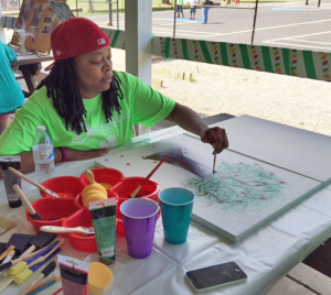 MG painting her canvas