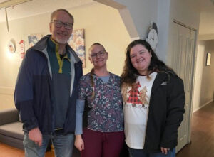 Three people posing for photo