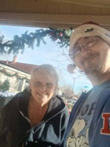 A woman and man smiling for photo