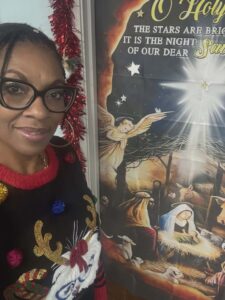 Carolyn Williams with Christmas door decoration