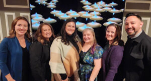 Group shot of six people.