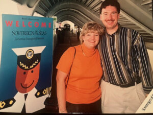 Kathy with her husband on a cruise ship.