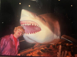 Kathy in front of a great white shark replica tourist attraction.