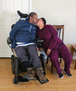 Victoria and James kissing.