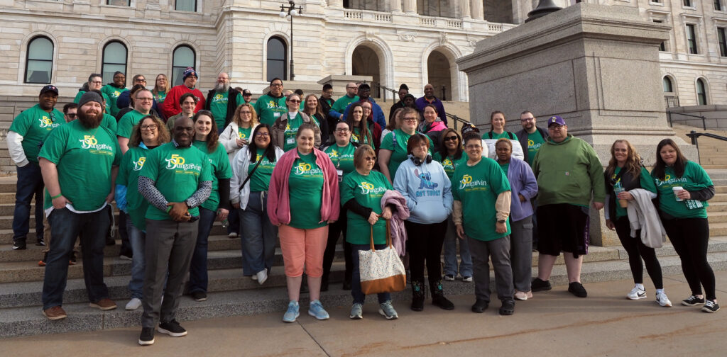 Large group of Dungarvin staff and persons served on the steps of the MN State Capitol.