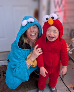 Jennifer McAlpine and her youngest son wearing Elmo costumes together.