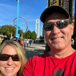Sheri Butler with her husband outside.
