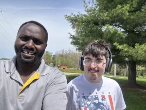 Stephen Kibii with Kolton, a man he supports.