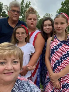 Maryanne and David Bufford posing with four of their daughters.