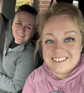 Keenan Pruett with wife Jillian sitting in a car.
