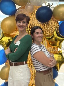 Diana Harris and Laura Johnson posing for the photo.