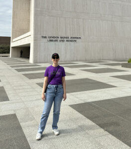 Sarah Cave standing in front of the Lyndon Baines Johnson Library and Museum building.