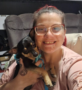 Monique Underwood holding her little dog.