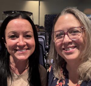 Tara Harkness and Brandy Gerdes-Schutz smiling at camera.